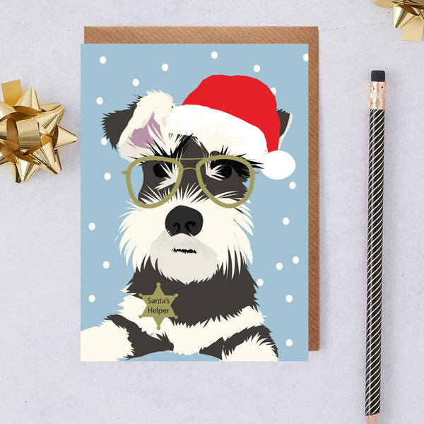 Christmas card of schnauzer dog called Monty wearing a hat